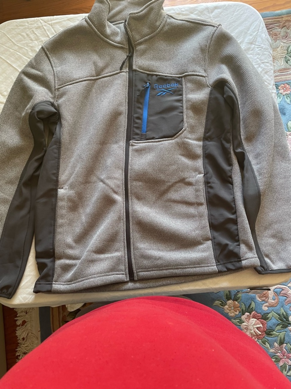 Reebok Gray and charcoal jacket.
Full zipper 
Chest and interior pockets
